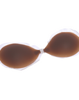 Product shot of a sticky and reusable Dark tint Silicone Stick-on Bra laying flat against white background, close-up shot showing clasp and thin edge of the Silicone Stick-on Bra