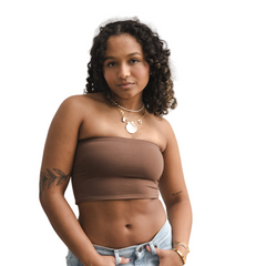 Product shot of NŪD Apparel Hunter Double-Layered Bandeau, strapless, cropped and seamless style, made of bamboo fabric produced in California, in Dark Nude on medium-skinned model paired with light-wash jeans, front shot