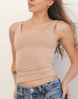 Product shot NŪD Apparel Devon Long Double Layer Scoop, wide strap, perfect length and seamless, made of bamboo fabric produced in California, in Light Nude on fair-skinned model paired with light-wash jeans, front shot