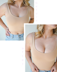 Product shot of Light tint Silicone Stick-on Bra size D-cup on fair-skinned model, wearing fitted Devon Crop Tank, before and after showing there is more cleavage and definition while looking natural without extra padding when wearing the Silicone Stick-on Bra
