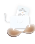 Product shot of sticky Light tint Silicone Stick-on Bra and durable Silicone Travel Case for Silicone Stick-on Bras in White and information insert card with wear and care instructions, against a white background showing the thin edges of the Silicone Stick-on Bra