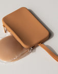 Product shot of our sticky Silicone Stick-on Bra in Medium tint and a durable Silicone Travel Case for the Silicone Stick-on Bra in Medium Nude, close-up shot showing the Boob-eez branded case and removable strap