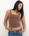 Product shot NŪD Apparel Devon Long Double Layer Scoop, wide strap, perfect length and seamless, made of bamboo fabric produced in California, in Dark Nude on medium-skinned model paired with dark-wash jeans, front shot
