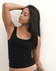 Product shot NŪD Apparel Devon Long Double Layer Scoop, wide strap, perfect length and seamless, made of bamboo fabric produced in California, in Black on medium-skinned model paired with dark-wash jeans, front shot