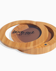 Product shot of the Boob-eez Bamboo Compact with Dark tint Headlight Hiders inside, close-up side shot showing the beautiful wood grain, magnetic closure, and translucent window to display the Headlight Hiders inside