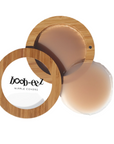 Product shot of Boob-eez Bamboo Compact with 6cm Medium tint Headlight Hiders inside and informative insert cards with wear and care instructions, close-up shot showing how to open and close the Bamboo Compact