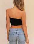 Product shot of Boob-eez Seamless Bandeau in Black, strapless and seamless style, easy layering piece under blouses, tanks, and low-cut dresses, amazing basic , back shot