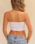 Product shot of Boob-eez Seamless Bandeau in White, strapless and seamless style, easy layering piece under blouses, tanks, and low-cut dresses, amazing basic , back shot