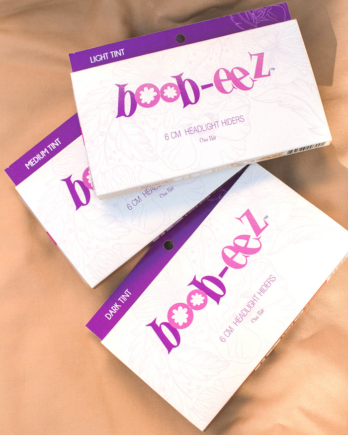 Boob-eez Headlight Hiders nipple cover packaging in light, medium and dark tints