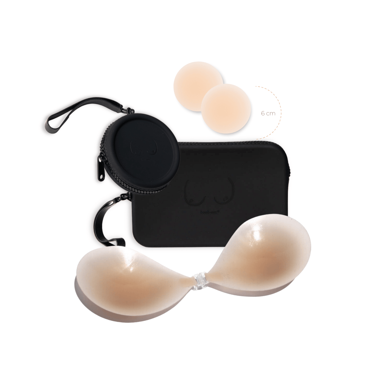 Product shot of sticky Light tint 6cm Headlight Hiders and Silicone Stick-on Bra and durable Silicone Travel Cases in Black and information insert card with wear and care instructions, against a white background showing the thin edges of the Silicone Stick-on Bra