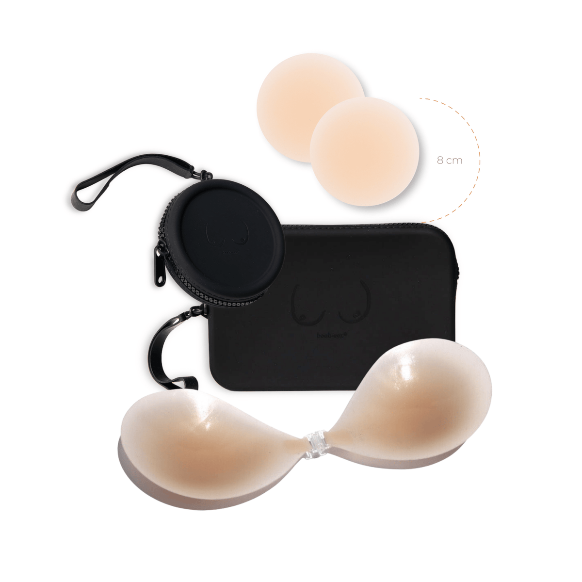 Product shot of sticky Light tint 8cm Headlight Hiders and Silicone Stick-on Bra and durable Silicone Travel Cases in Black and information insert card with wear and care instructions, against a white background showing the thin edges of the Silicone Stick-on Bra
