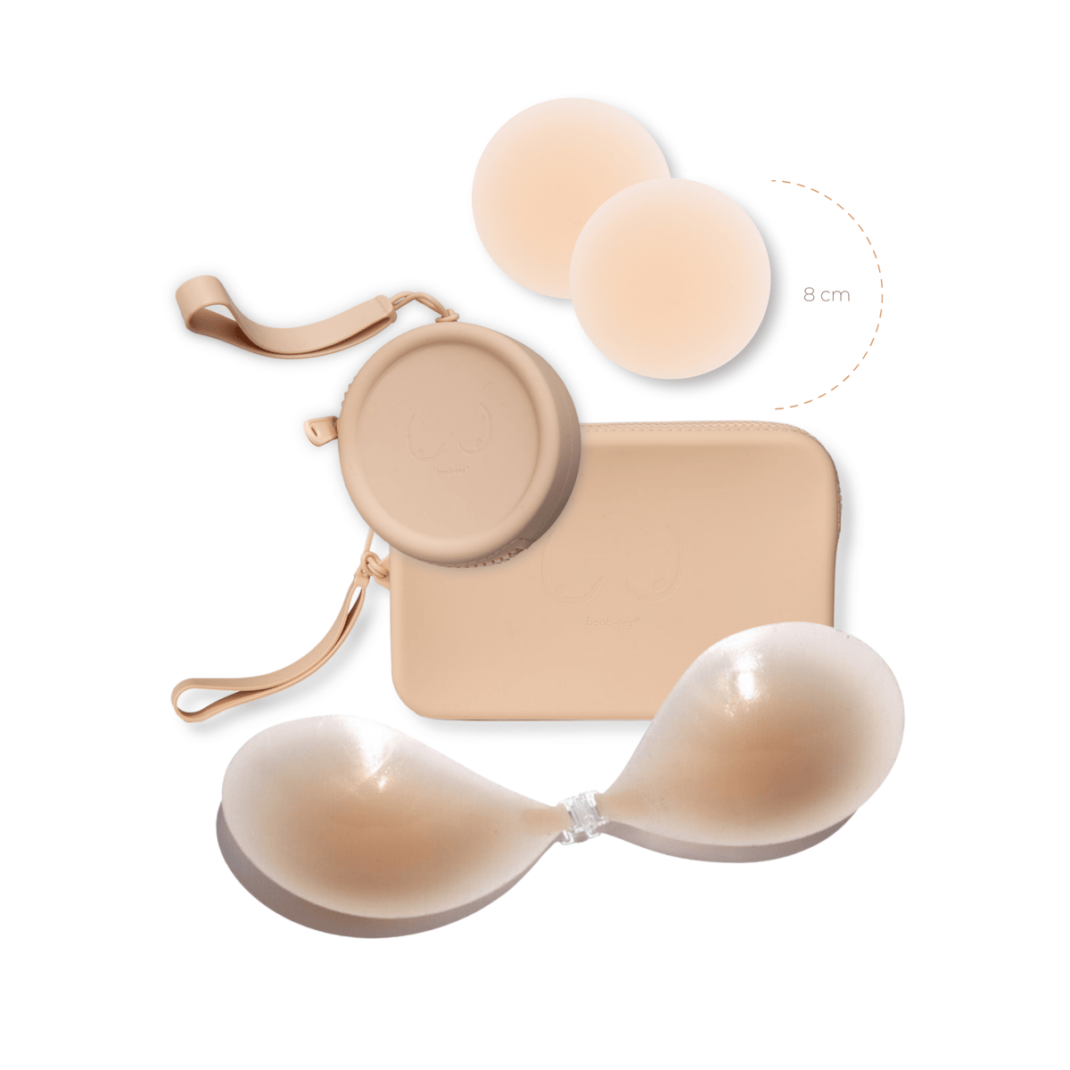 Product shot of reusable Light tint 8cm Headlight Hiders and sticky Silicone Travel Case for Headlight Hiders and a Silicone Travel Case for a sticky Stick-on Bra in Light Nude with a removable strap and zipper detail, against a white background showing the thin edges of the Headlight Hiders
