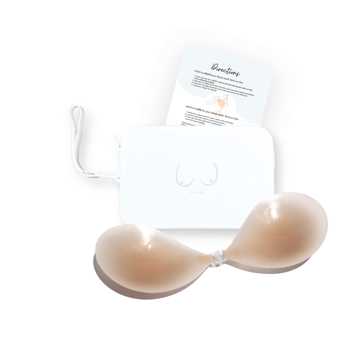 Product shot of sticky Light tint Silicone Stick-on Bra and durable Silicone Travel Case for Silicone Stick-on Bras in White and information insert card with wear and care instructions, against a white background showing the thin edges of the Silicone Stick-on Bra