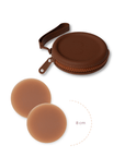 Product shot of reusable Dark tint 8cm Headlight Hiders and Silicone Travel Case for sticky Headlight Hiders in Dark Nude with a removable strap and zipper detail, against a white background showing the thin edges of the Headlight Hiders
