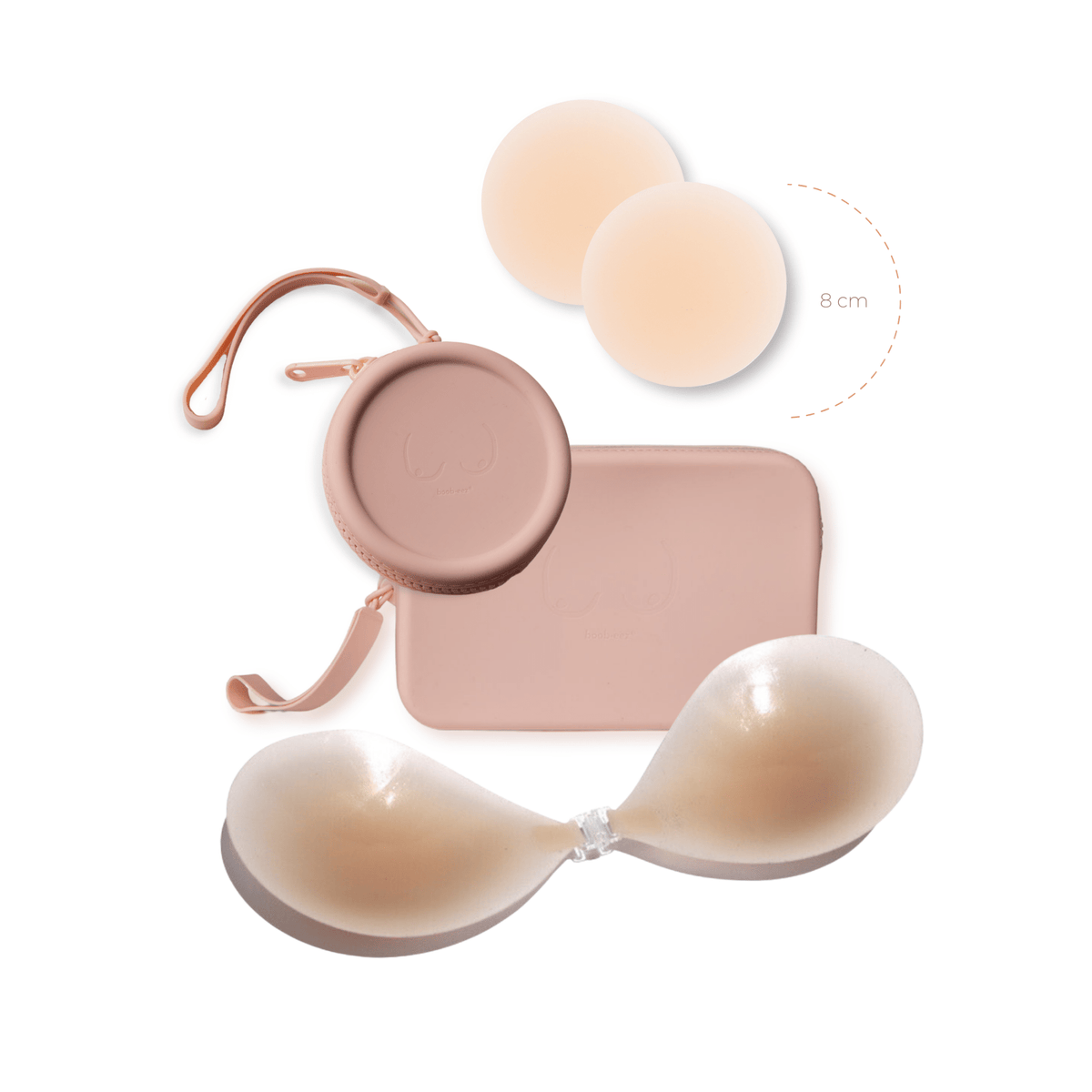 Product shot of sticky Light tint 8cm Headlight Hiders and Silicone Stick-on Bra and durable Silicone Travel Case for Silicone Stick-on Bras in Dusty Pink and information insert card with wear and care instructions, against a white background showing the thin edges of the Silicone Stick-on Bra