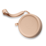 Product shot of the durable Silicone Travel Case for the Headlight Hiders in Light Nude, close-up shot showing the Boob-eez branded case and removable strap