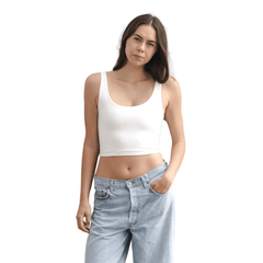 Product shot of NŪD Apparel Devon Double Layered Scoop Crop top, wide strap and seamless, made of bamboo fabric produced in California, in White on fair-skinned model paired with light-wash jeans, front shot