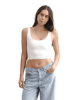 Product shot of NŪD Apparel Devon Double Layered Scoop Crop top, wide strap and seamless, made of bamboo fabric produced in California, in White on fair-skinned model paired with light-wash jeans, front shot
