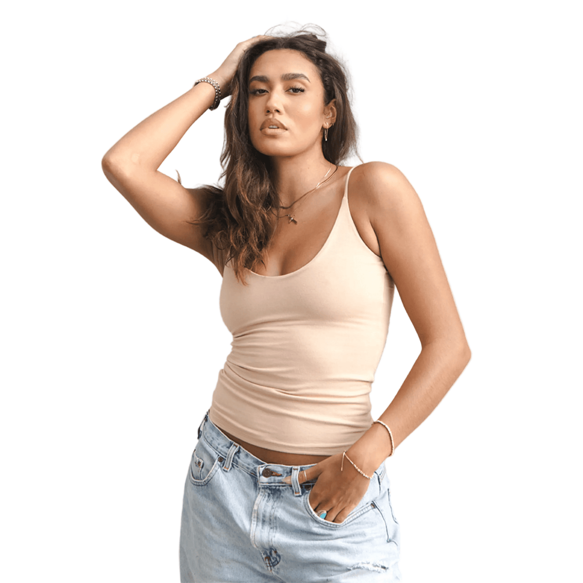 Product shot of NŪD Apparel Nesha Double Layered Tank, thin strap, long style and seamless, made of bamboo fabric produced in California, in Light Nude on medium-skinned model paired with light-wash jeans, front shot