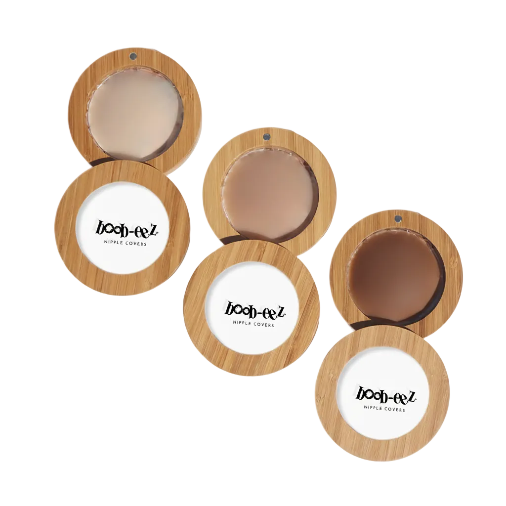Product shot of Boob-eez Bamboo Compacts with Headlight Hiders in Light tint, Medium tint, and Dark tint, close-up shot showing the difference between the color/tints of the Headlight Hiders