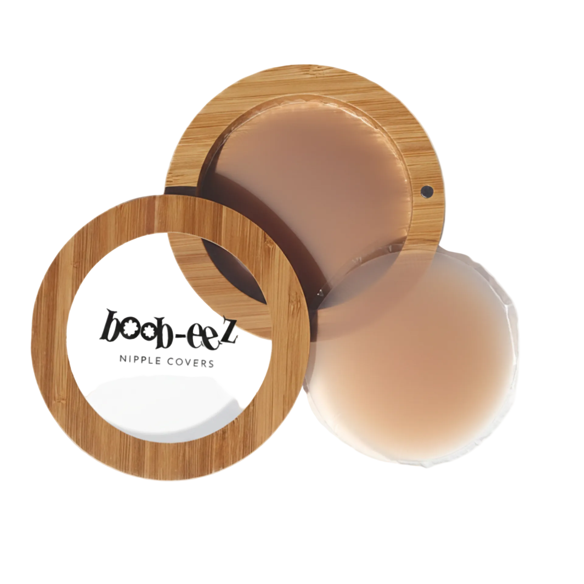 Product shot of Boob-eez Bamboo Compact with 6cm Medium tint Headlight Hiders inside and informative insert cards with wear and care instructions, close-up shot showing how to open and close the Bamboo Compact