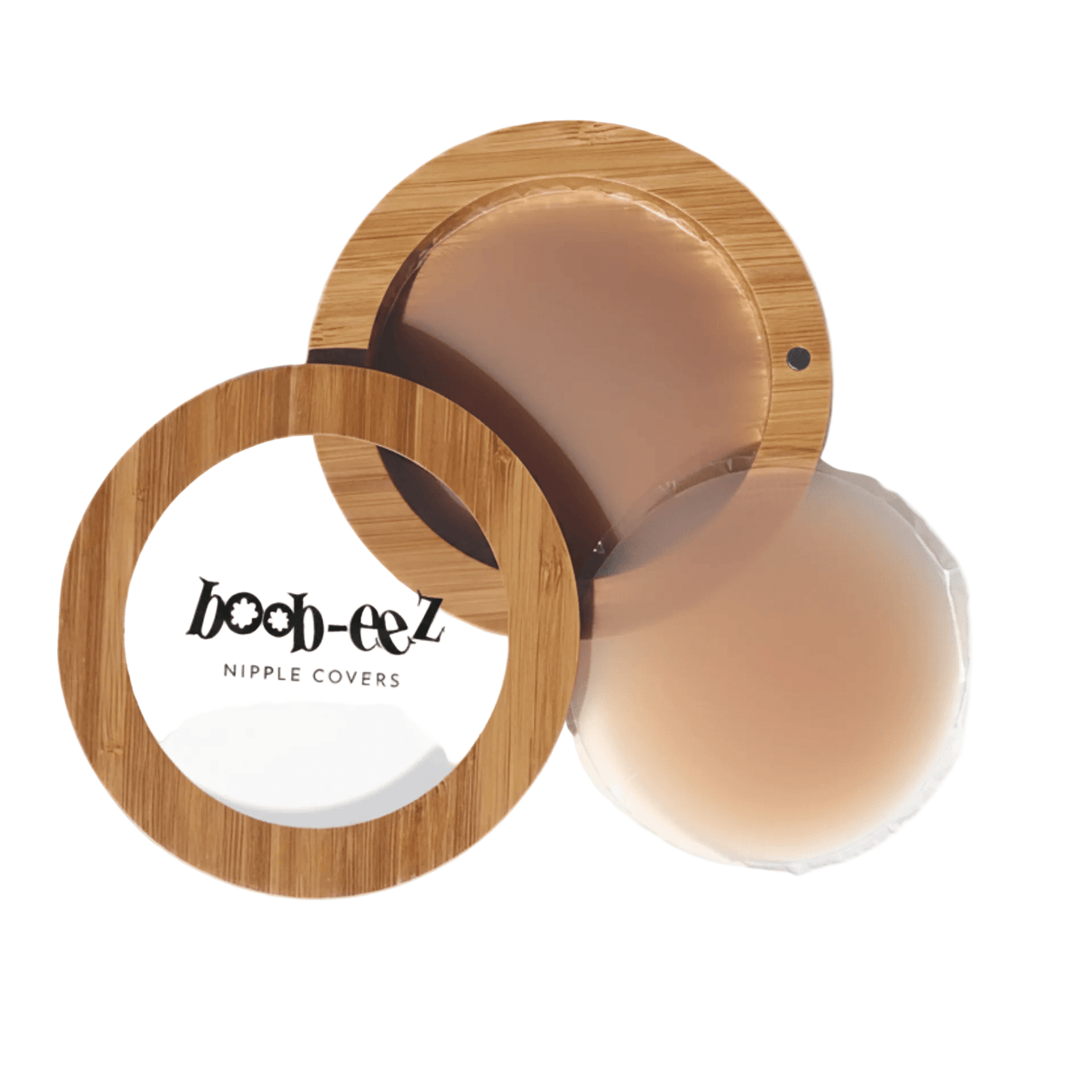 Product shot of Boob-eez Bamboo Compact with 6cm Medium tint Headlight Hiders inside and informative insert cards with wear and care instructions, close-up shot showing how to open and close the Bamboo Compact